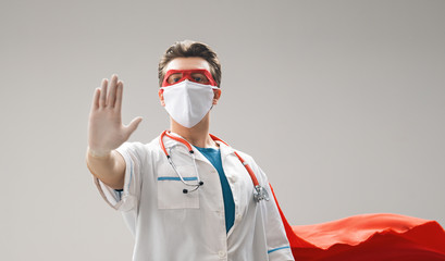 Doctor wearing facemask and superhero cape