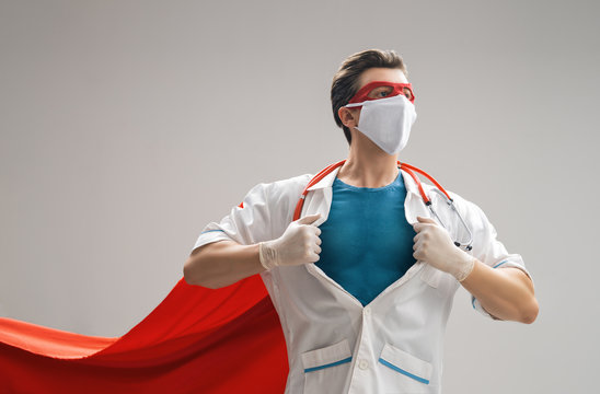 Doctor Wearing Facemask And Superhero Cape