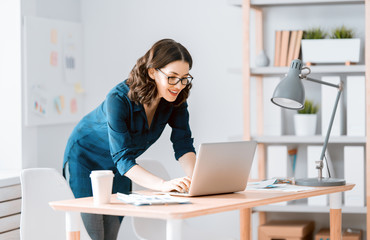 woman working on a laptop at home.