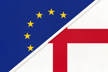 European Union or EU vs England national flag from textile. Symbol of the Council of Europe association.