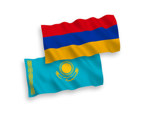 National vector fabric wave flags of Kazakhstan and Armenia isolated on white background. 1 to 2 proportion.