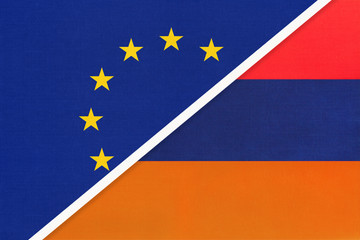 European Union or EU vs Armenia national flag from textile. Symbol of the Council of Europe association.
