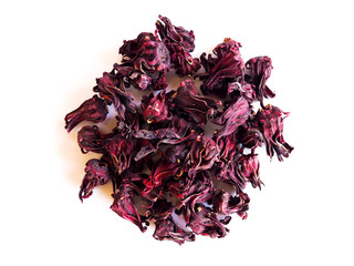 Top view of pile of dried roselle flowers isolated on white background.