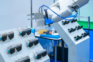 Aluminum and robot arm. Robot for manufacturing and testing aluminum parts. Robotics at an industrial enterprise. The use of robots in the metalworking. Automation of the enterprise.