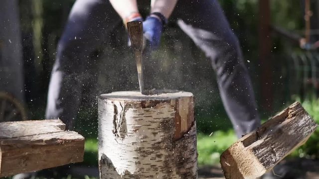 A slow-motion clip of wood chopping