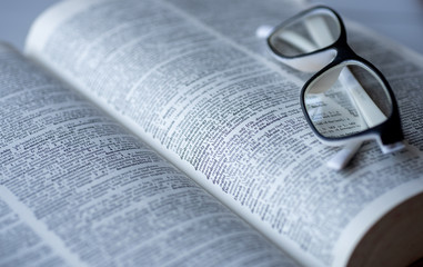 Fototapeta premium Dictionary and glasses