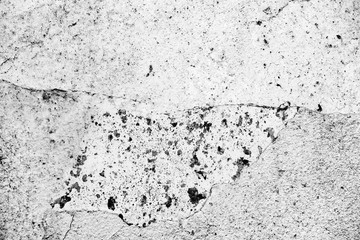 Texture of a concrete wall with cracks and scratches which can be used as a background