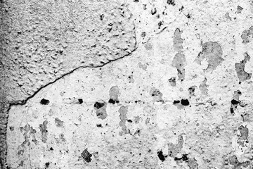 Texture of a concrete wall with cracks and scratches which can be used as a background