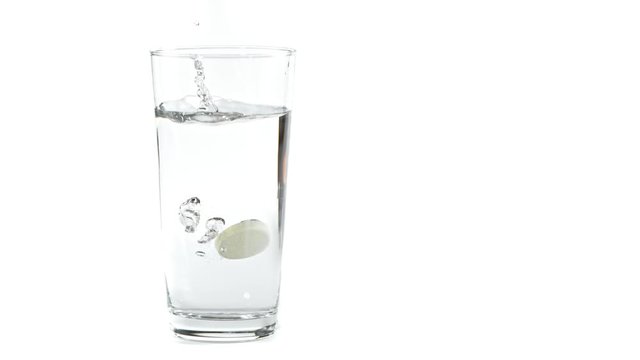 Super Slow Motion Shot of Falling Tablet into water Isolated on White Background at 1000fps.