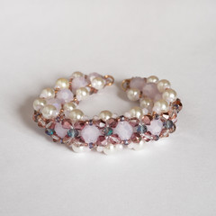 Hand made beaded bracelet on the background