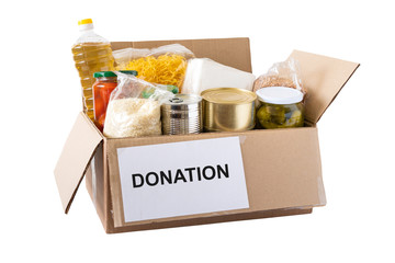 Cardboard box with oil, canned food, cereals and pasta.