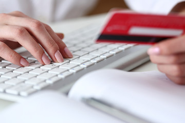 Female hands hold credit card