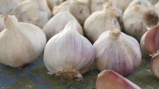 Fresh raw rustic eco garlic with segments on wooden background. Healthy food. Shopping food supermarket