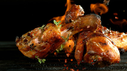 Chicken meat pieces on grill