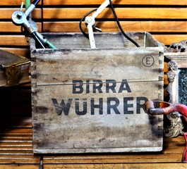 Milan, Italy, 2017.05.21 evocative image of an old wooden box with the inscription "Wuhrer beer"
at a vintage market