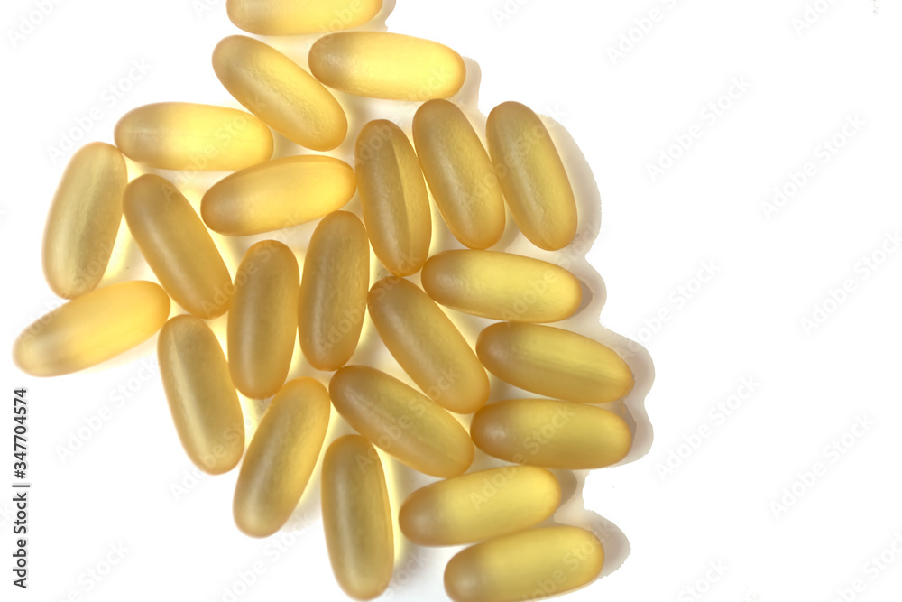 Wall mural yellow pills or vitamins on the white background. healthy life style. pandemic concept.