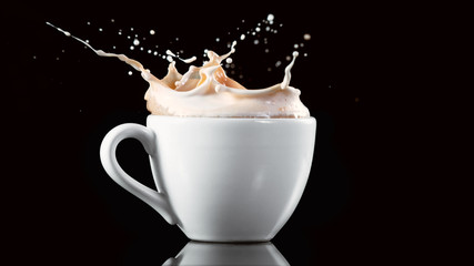 A cup with a large splash of coffee.