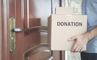 Caucasian volunteer with Donation box.