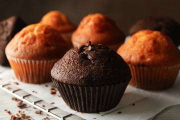 Composition with tasty muffins on white wooden background