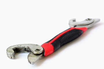 Hand tool, adjustable wrench on white background.