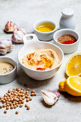 Hummus bowl and ingredients for making hummus. Vegan food concept.