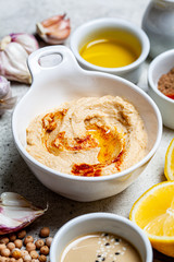 Hummus bowl and ingredients for making hummus. Vegan food concept.