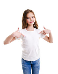 Portrait of adorable smiling little girl child preteen in the white t-shirt pointing to yourself by...