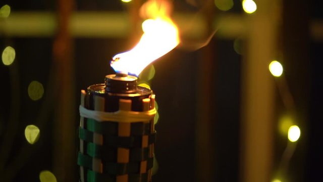 Cinematic shot of Bamboo oil lamp or pelita for eid or hari raya decoration 