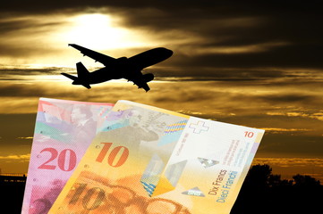 Ein Flugzeug und Geld Schweizer Franken CHF