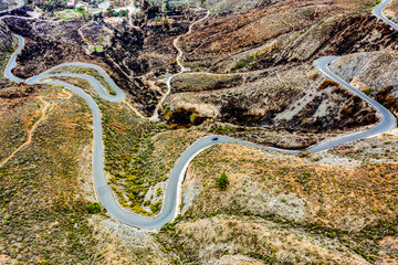 A unique road among high mountains in a beautiful mood of nature