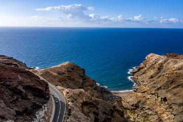 A unique road among high mountains in a beautiful mood of nature