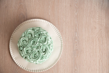 Fototapeta na wymiar delicious round turquoise green birthday cake