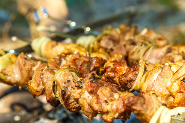Preparation of shish kebab on outdoor charcoal grill