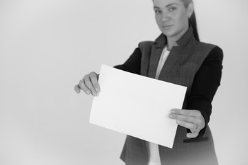 showing blank piece of paper isolated over gray background