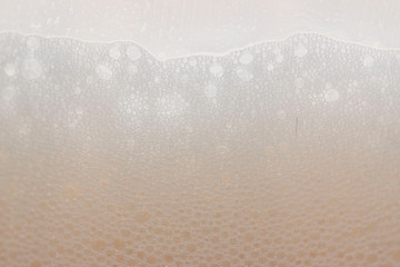 beer foam with bubbles as a background