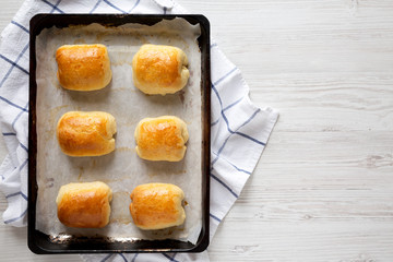 Home-baked Beef Russian Bierocks on tray, overhead view. Flat lay, top view, from above. Copy space.