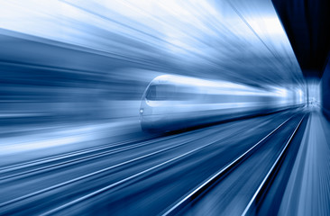 High speed train runs on rail tracks . Train in motion.