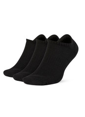 Black color socks isolated on white background. One pair of socks. Set of black socks for sports on foot as mock up for advertising, branding, design mockup, isolated, clipping path.