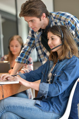 Students at home working on laptop