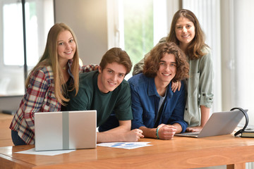 Group of students using laptop computer