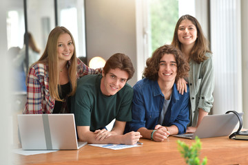Group of students using laptop computer