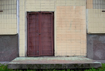 Closed metal door with grille