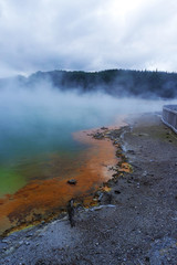 Geothermal lake with an orange shoreline