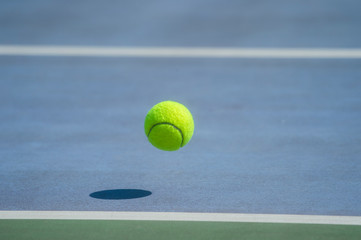Close-Up Of A Shadow And A Tennis Ball. Individual sport