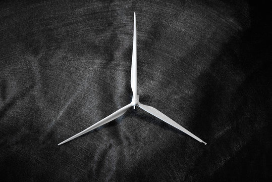 White windmill on a dark background