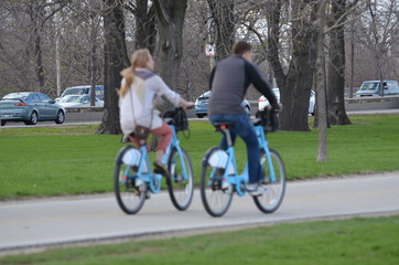 young couple riding bikes
