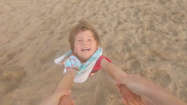 Kid Enjoys being spin by his dad
