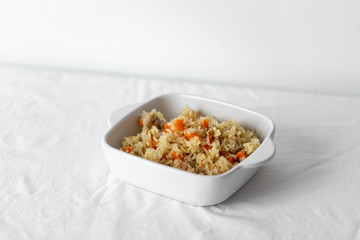 Lamb pilaf in a bowl on white  background with copy space
