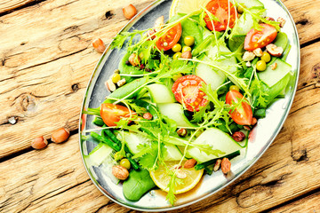 Plate of salad with vegetables and greens