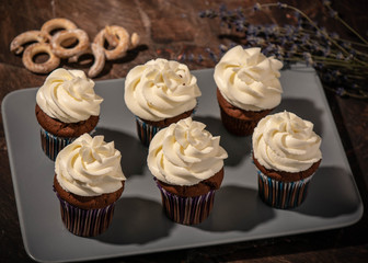 chocolate cupcakes with crackers on a plate
